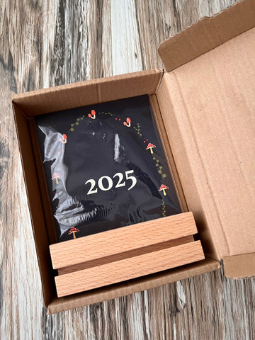 2025 calendar packed in individual box, with the wooden stand included