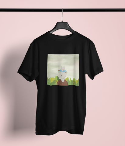 The image shows a black graphic t-shirt. The graphic on the t-shirt is a whimsical twist of Frida Kahlo's self portrait. The protagonist is a bunny, instead of the artist herself. 