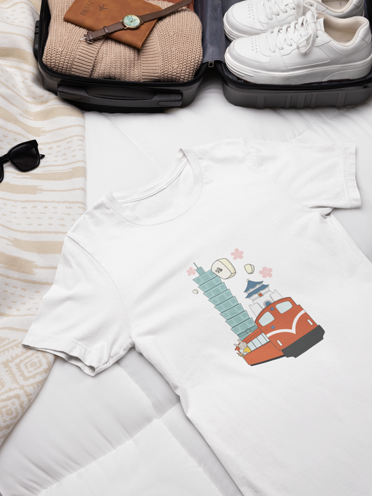 The image shows a flat lay T-shirt with a Taiwan theme illustration.The illustration features a cartoon bunny holding a bubble tea while riding on a red train. The background includes notable landmarks such as Taipei 101, a traditional Chinese pagoda, and a Taiwanese red lantern with the character 福 (meaning "fortune" or "blessing"). There are also two cherry blossoms floating in the air. The overall theme is a charming and whimsical depiction of Taiwan's culture.